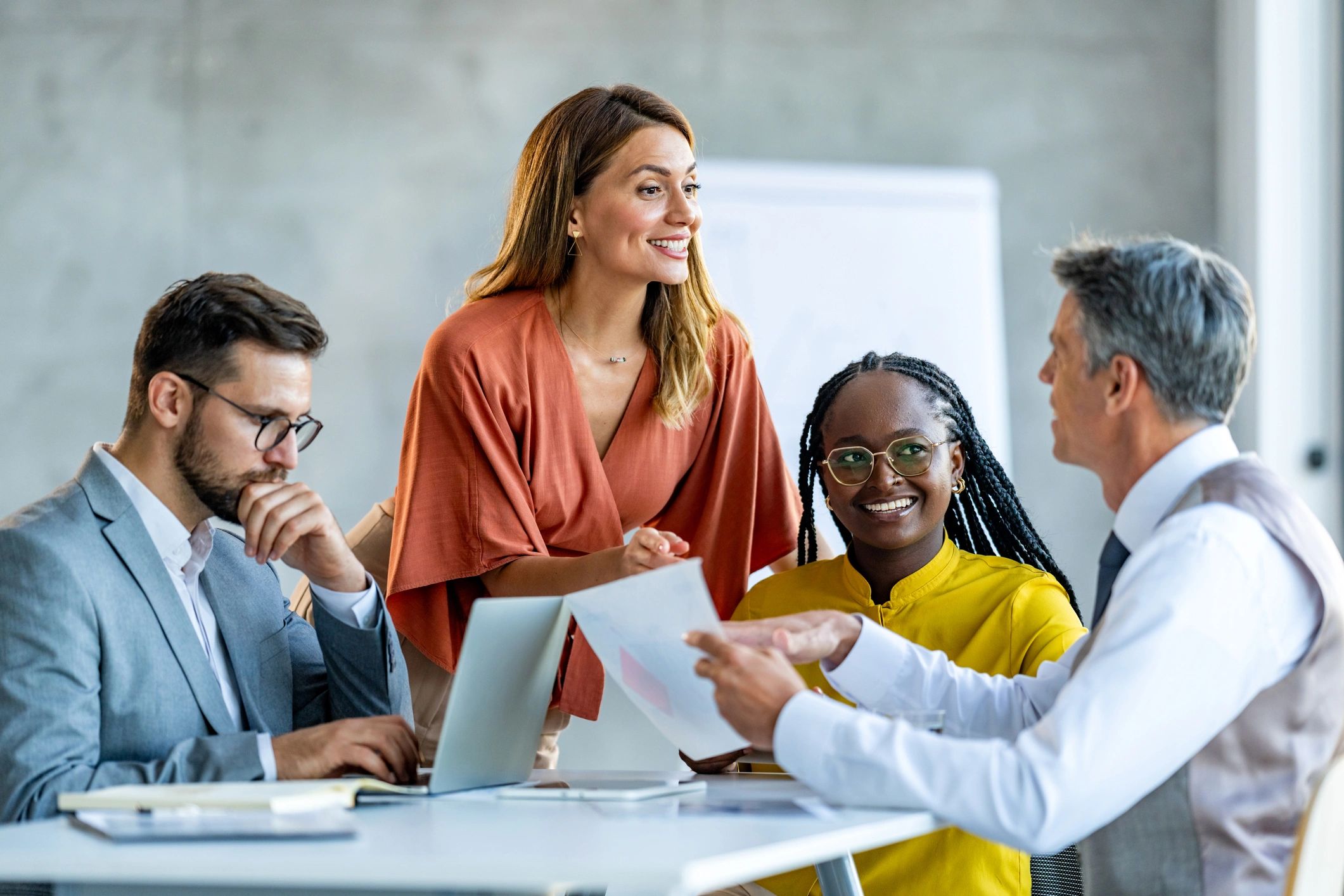 Colleagues discussing a project in an office