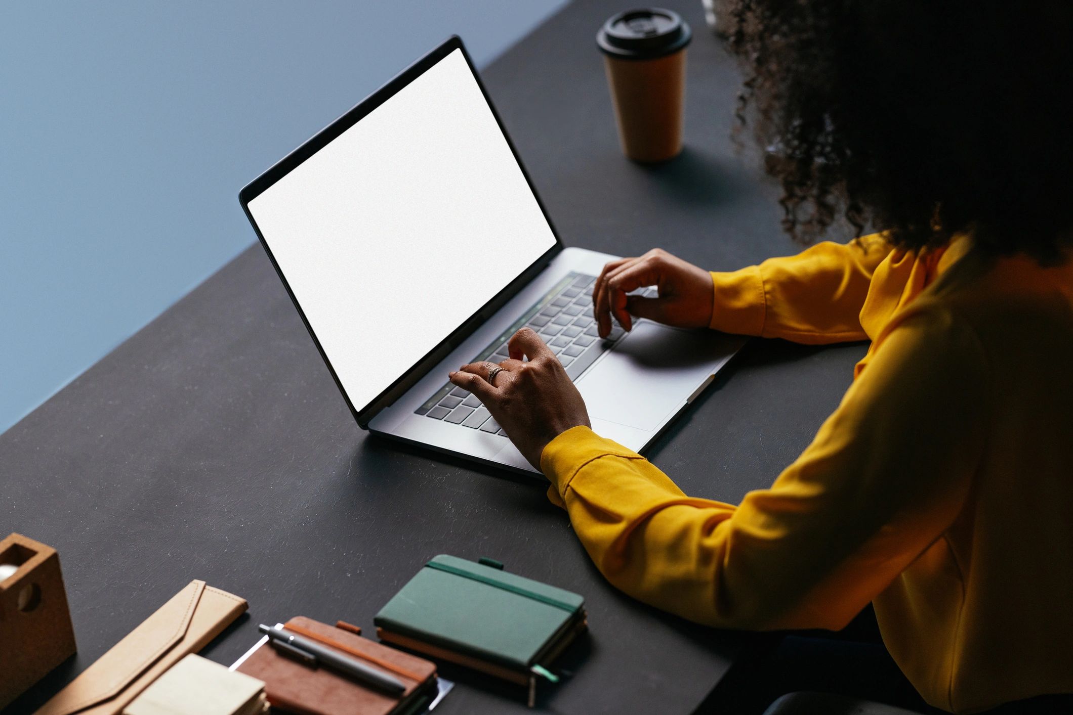 Young woman working on laptop in a modern office